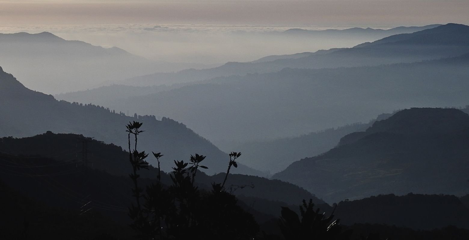 Panoramic view of the high Andean mountains and cloud-covered valleys in Bosque Guajira Natural Reserve near Bogotá, Colombia.