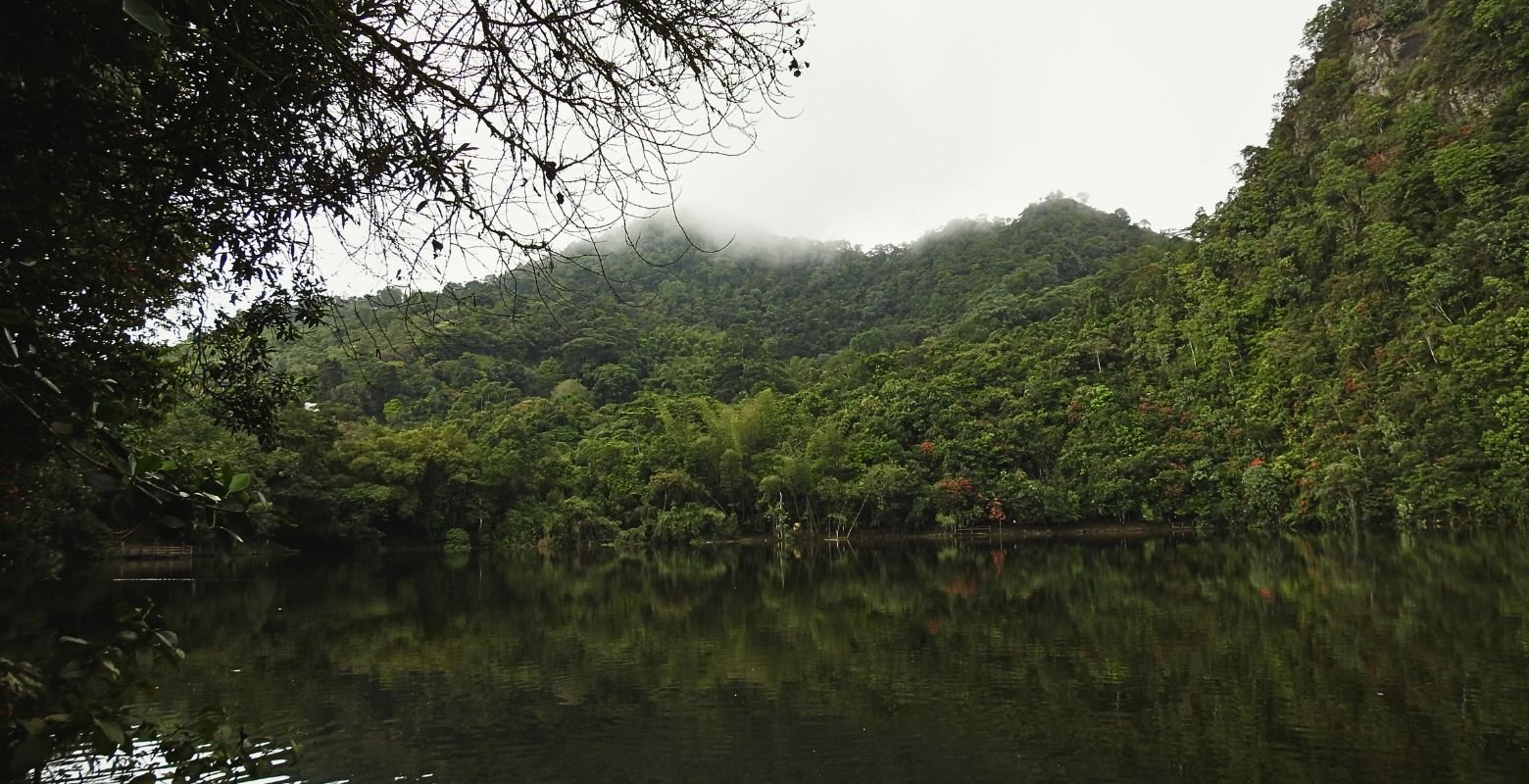 Tabacal Lagoon surrounded by forested Andean mountains and mist